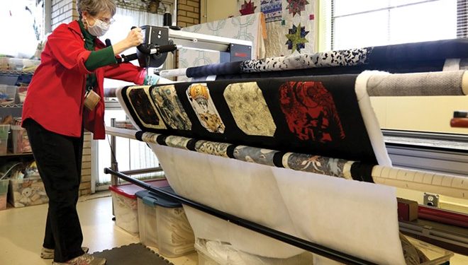 Anne Hennig uses a machine to sew a quilt at City Sewing Room in St. Louis. - PHOTO BY CHRISTINE TANNOUS/ST. LOUIS POST-DISPATCH/TNS
