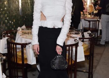 Chiu, wearing a Khaite top, Alexandre Vauthier skirt, Amina Muaddi shoes and a Vivienne Westwood bag, at Kathy Hilton's birthday party, styled by Dani Michelle. 
