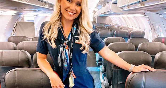 Caroline Skahn in her flight attendant uniform on a plane