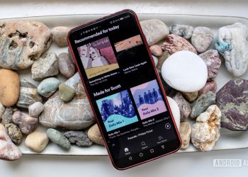 Spotify menu on a smartphone on a bed of rocks