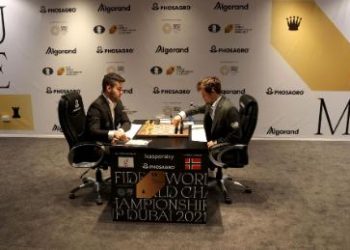 Russia's Ian Nepomniachtchi, left, and Norway's Magnus Carlsen compete during Game 11.