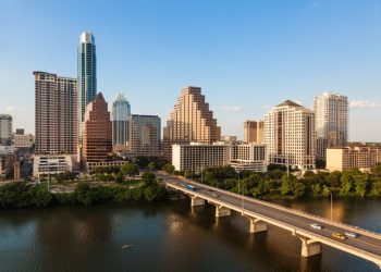 Austin's skyline including the Congress Avenue bridge over Ladybird Lake.