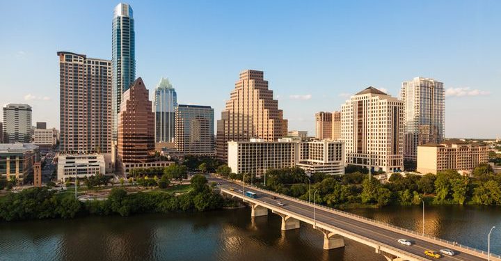 Austin's skyline including the Congress Avenue bridge over Ladybird Lake.