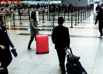Passengers make their way to the security checkpoint at the John F. Kennedy airport in New York City.
