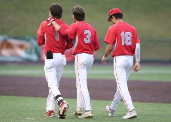 Mundelein’s Michael Farina (1), Drew Wellington (3), and Christian Seminaro (16), walk off the field after losing to Edwardsville in the Class 4A title game.