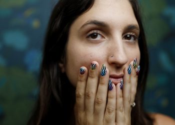 A woman shows off her manicure.