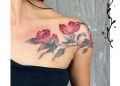 A Japanese camellia tattoo above the breast.