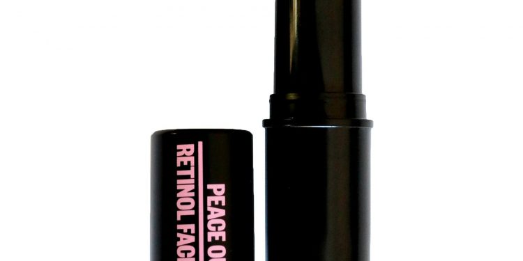 Peace Out Skincare Retinol Face Stick black tube off beige retinol stick on white background