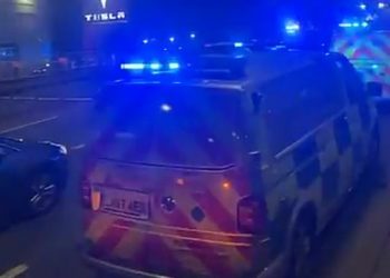 Police were called at 3.48am to the crash on the A40 near Park Royal underground station after the Range Rover ended up on the railway track. Pictured: Met Police at the scene