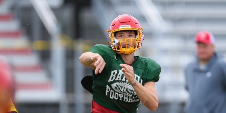 Batavia’s Ryan Boe passes the football during practice.