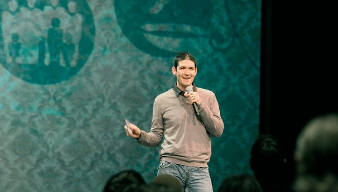In this Jan. 3, 2010 photo, pastor Matt Chandler speaks to his congregation in Flower Mound, Texas for the first time following his brain surgery.