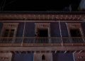A man stands on a balcony in San Juan after a major power outage on April 6, 2022.