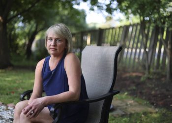 Christine Settingsgaard sits in her yard on Wednesday, Sept 14, 2022, in Barrington. Settingsgaard was lured into sophisticated financial scam this summer via a man she met on Hinge, and “lost everything.”