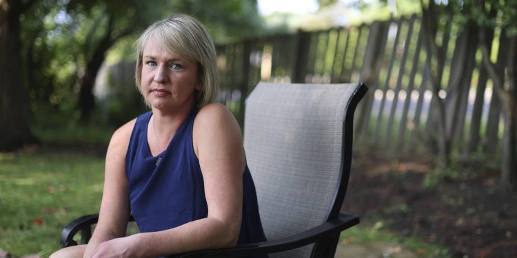Christine Settingsgaard sits in her yard on Wednesday, Sept 14, 2022, in Barrington. Settingsgaard was lured into sophisticated financial scam this summer via a man she met on Hinge, and “lost everything.”